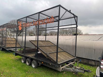 Two Converted Flat Bed Trailers Used As Axe